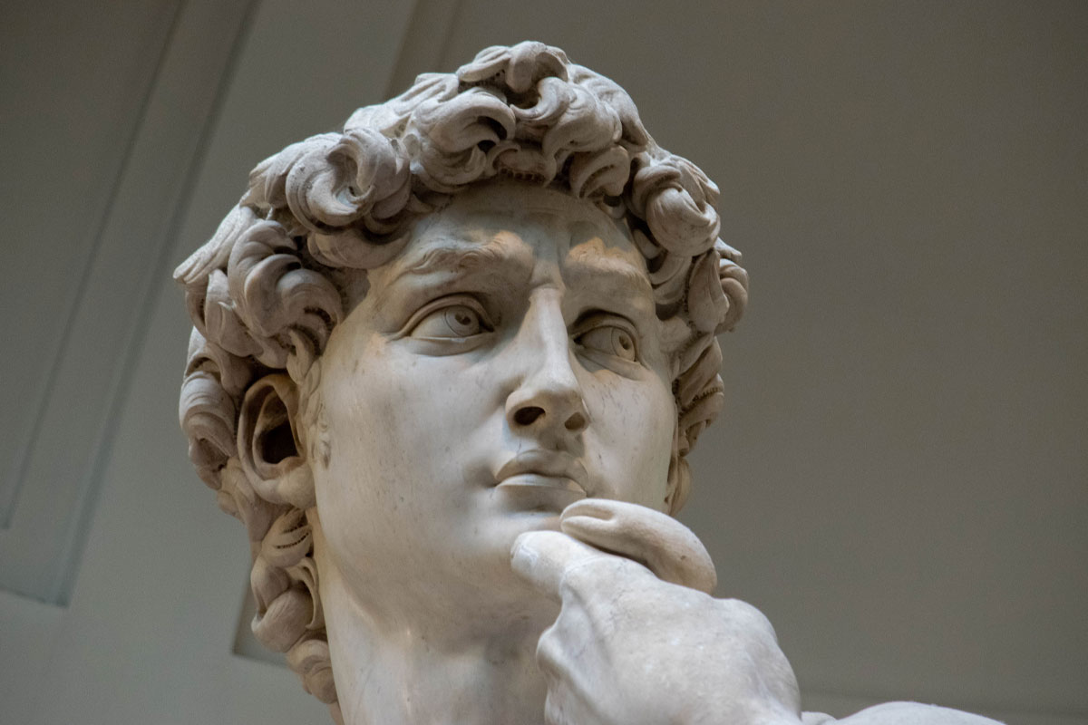 Close-up of David's face showing intense expression and marble details