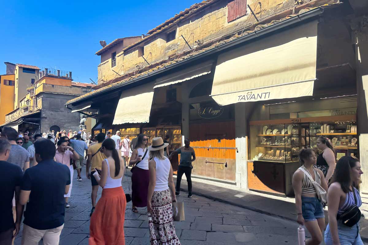 Historic gold jewelry shops inside Ponte Vecchio bridge Florence luxury shopping