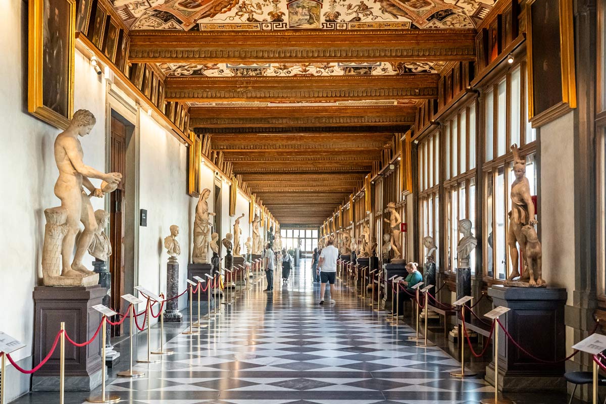 Long gallery corridor at Uffizi showing Renaissance paintings